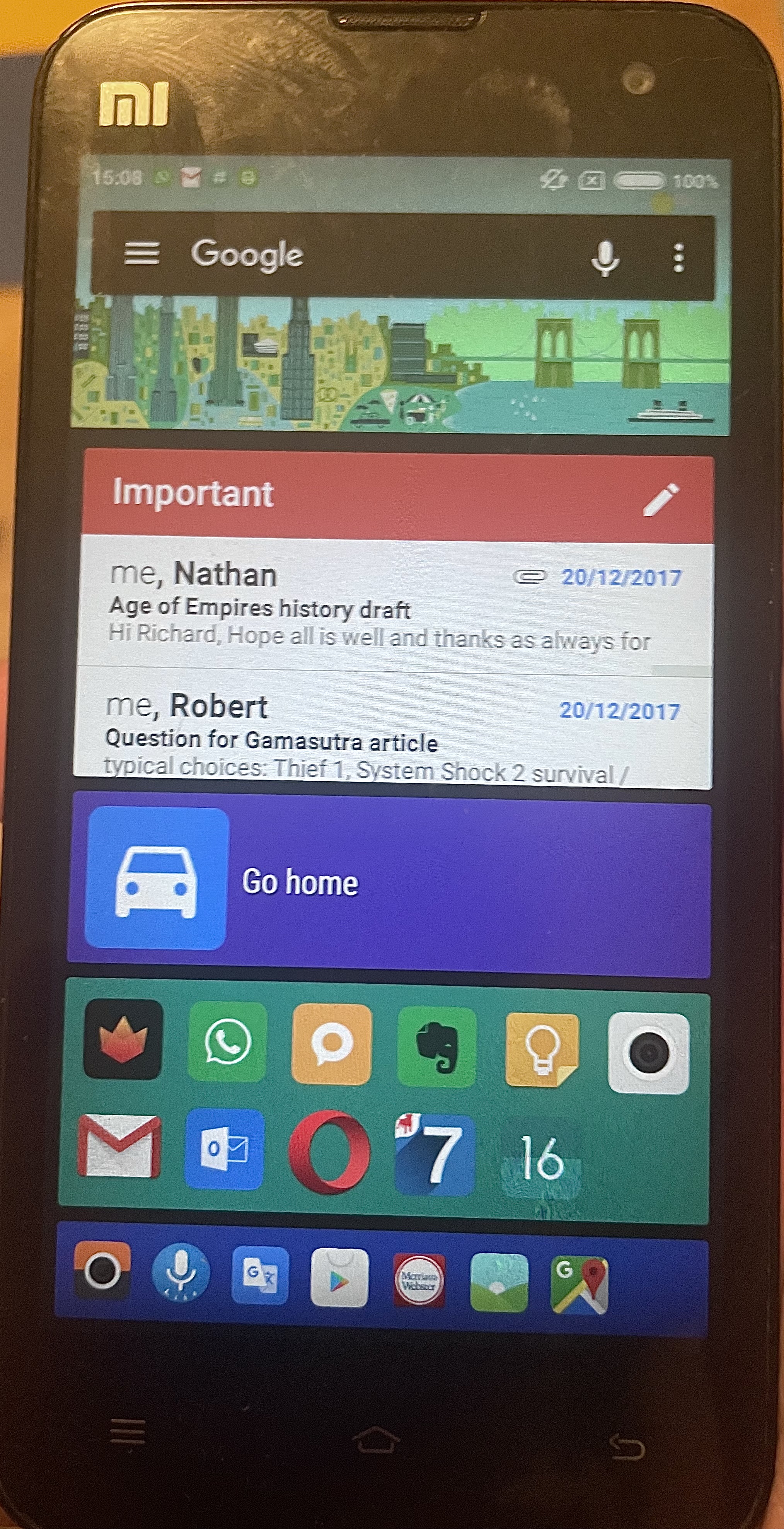 An old Xiaomi Android phone showing a multi-coloured homescreen with various icons and a Gmail widget with two unread messages dated 20 Dec 2017